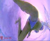 Amazing underwater bikini show. Elegant flexible babe swims from underwater bikini