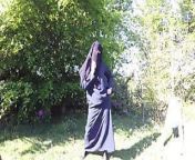Muslim in burqa and stockings – flashing outdoors from burqa and pantyhose in the rain