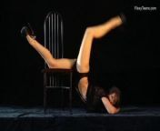 Naked gymnast Kim Nadara doing gymnastics on chair from deep yoga stretch with kim