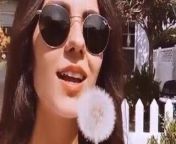 Victoria Justice with a dandelion from nickelodeon most wanted bumpers