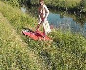 Nudist beach. Public nudity. Sexy MILF without panties and bra sunbathes naked is not shy about fisherman. Naked in public. Milf from naturist