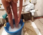 A village girl washes her body in a basin of water after work from pussy water after sex