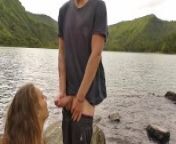 Horny couple pleasuring each other and making love passionately at a volcanic crater lake from in the lake