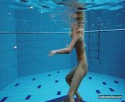 Sexiest brunette Milana Voda swimming in pool from vbda