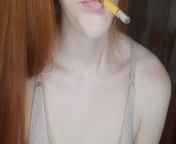 redhead girl smokes a cigarette from siberian mpuse